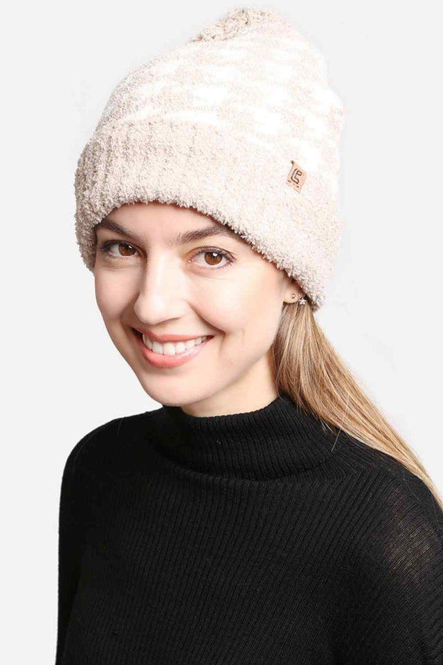 Beige Houndstooth Pom Pom Beanie with Lining features a classic houndstooth pattern with a cozy, lined interior and a fluffy pom for extra warmth. Designed with a soft stretch fit, it delivers comfortable insulation while adding timeless style to your cold-weather outfits.