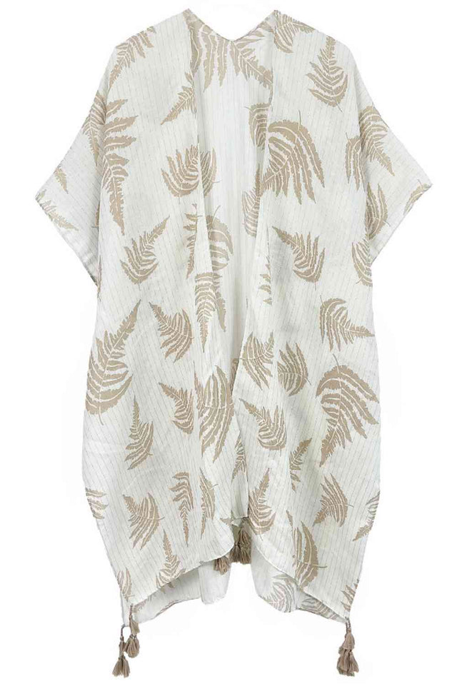 Beige Effortless elegance meets bohemian charm with this stunning leaf print kimono. Crafted from lightweight polyester, it features a sophisticated two-tone design accented with shimmering lurex threading and playful tassels at the hem. The generous 35.4" x 35.4" dimensions provide a relaxed, flowing fit perfect for layering over any outfit. Whether you're heading to the beach, a casual brunch, or an evening out, this versatile piece transitions seamlessly from day to night. A wardrobe essential that bring