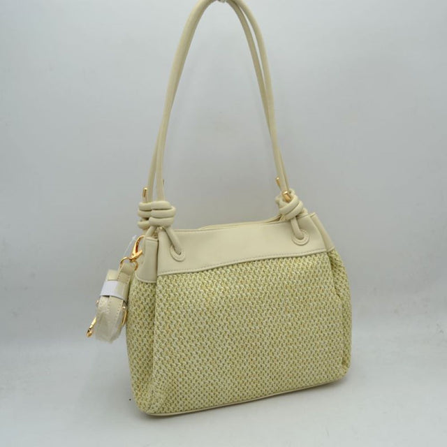 Beige Embrace a relaxed yet sophisticated aesthetic with this beautifully textured shoulder bag. The design prominently features a classic woven mesh panel across the main body, paired seamlessly with smooth trim along the upper edge and base. Dual slender shoulder straps attach to the bag with elegant, integrated knot details at the base, offering a comfortable drop for easy over-the-shoulder carrying. Adding to its versatile utility, a small, matching clip-on zippered pouch hangs from the side hardware