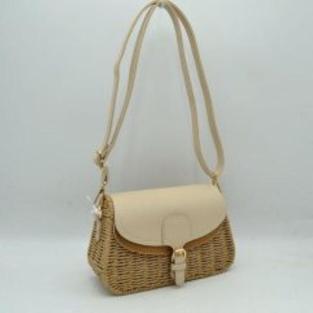 Beige This everyday shoulder bag features a distinct textured woven body paired with a smooth fold-over flap closure. The bag includes a main storage compartment secured by a front strap and buckle detail. It is equipped with a long, adjustable shoulder strap attached via metal hardware, providing versatile carrying options for daily use.