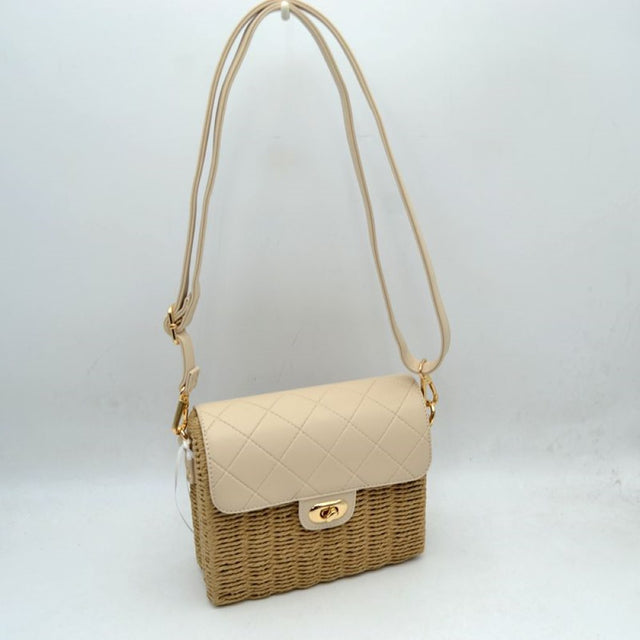 Beige Add a touch of effortless charm to your ensemble with this beautiful woven crossbody bag, perfect for warm-weather outings, vacation days, or casual weekend brunch. Combining natural, textured appeal with structured sophistication, this accessory features an intricate woven body paired with a classic quilted top flap. The secure turn-lock closure on the front keeps your essentials safe while adding a polished accent to the overall design.