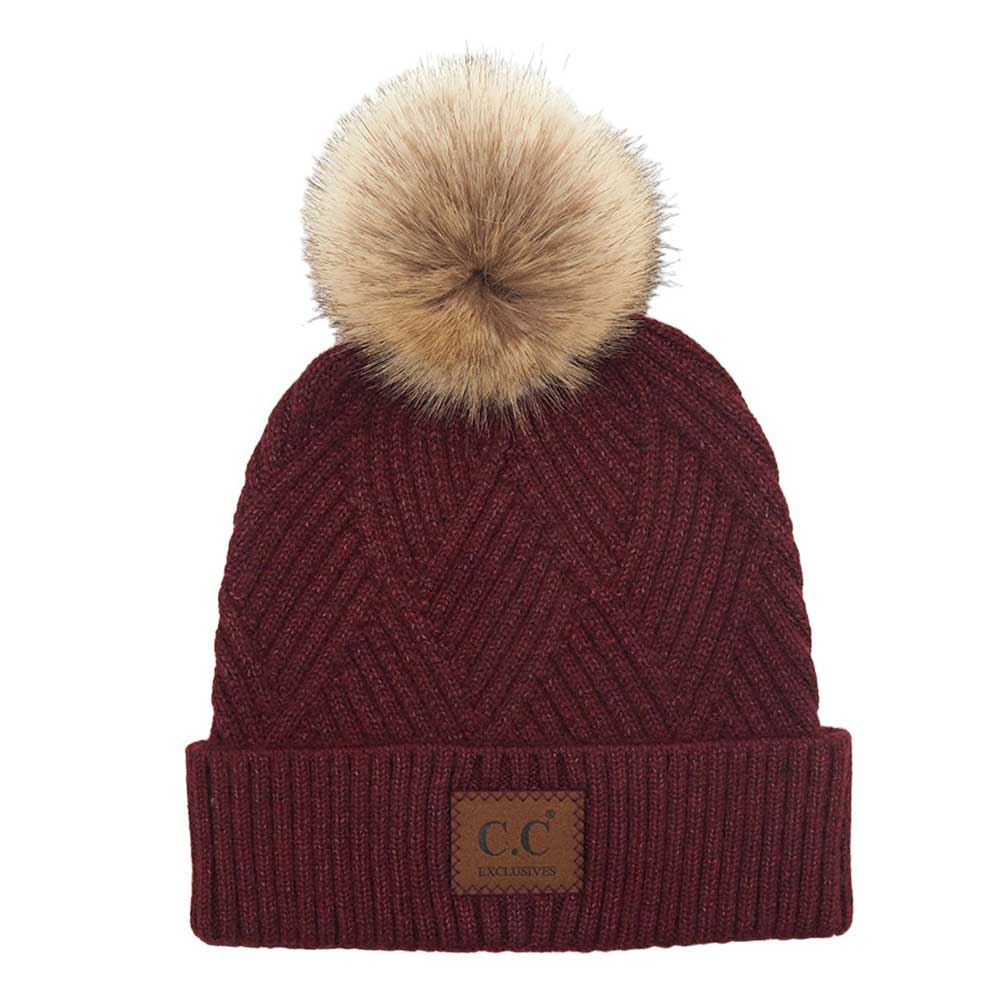 Berry C.C Heather Beanie Hat With Pom Pom And Suede Patch, provides excellent protection and a fashionable look with its soft heather knit material, faux fur pom pom, and stylish suede patch. The fabric is designed to keep you comfortably warm in cold weather. Add this fashionable accessory to the winter wardrobe collection.