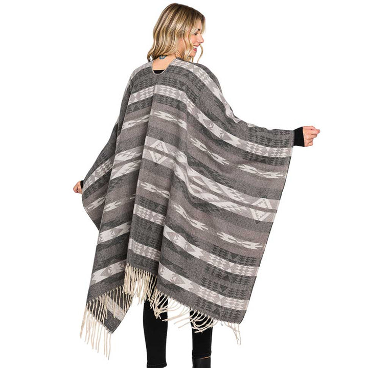 Black Aztec Patterned Fringe Ruana Poncho, with the latest trend in ladies' outfit cover-up! the high-quality knit poncho is soft, comfortable, and warm but lightweight. It's perfect for your daily, casual, party, evening, vacation, and other special events outfits. A fantastic gift for your friends or family.