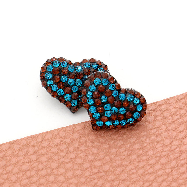 Black-Blue-Zircon-Smoked-Topaz-Crystal Paved Heart Stud Earrings feature a beautiful, sparkling design that adds elegance and charm to any outfit. Made with high-quality crystals, these earrings are both stylish and durable. Elevate your look with these timeless, sophisticated earrings.