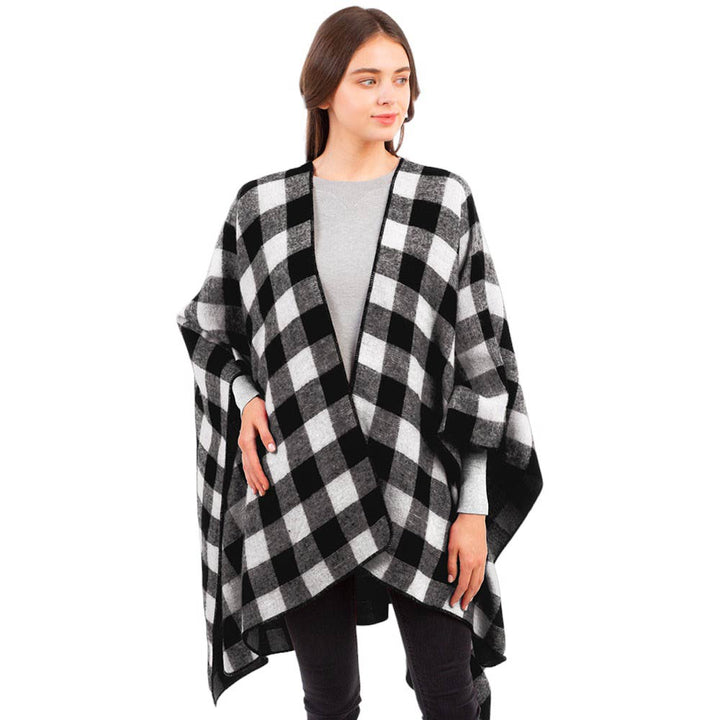 Black Buffalo Plaid Pattern Cape Ruana Poncho, is perfect for making a fashion statement in the cold times. The unique pattern combines classic buffalo plaid with a modern cape look. Crafted of lightweight materials, it features a full-length design for an effortless style, making it a great winter gift. 