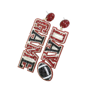 Black Burgundy Game Day Message Football Bling Dangle Earrings, feature a sparkling crystal football and message charms with a metallic finish. Show your team spirit with these whimsical earrings. The perfect accessory for the biggest game days and the perfect gift for sports lovers. 