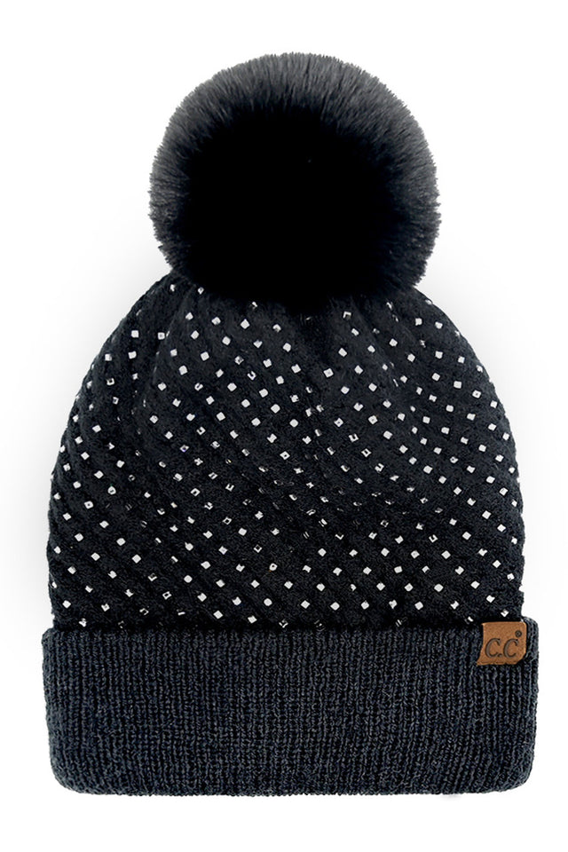 Black C.C Allover Rhinestone Pom Beanie combines expert craftsmanship with stylish practicality. Crafted from soft, warm knit material, this beanie is adorned with shimmering rhinestones for an elegant yet understated sparkle. The plush pom on top adds a classic touch while ensuring cozy protection against cold weather. Perfect for elevating your winter wardrobe, it offers a refined blend of comfort, durability, and sophistication. 