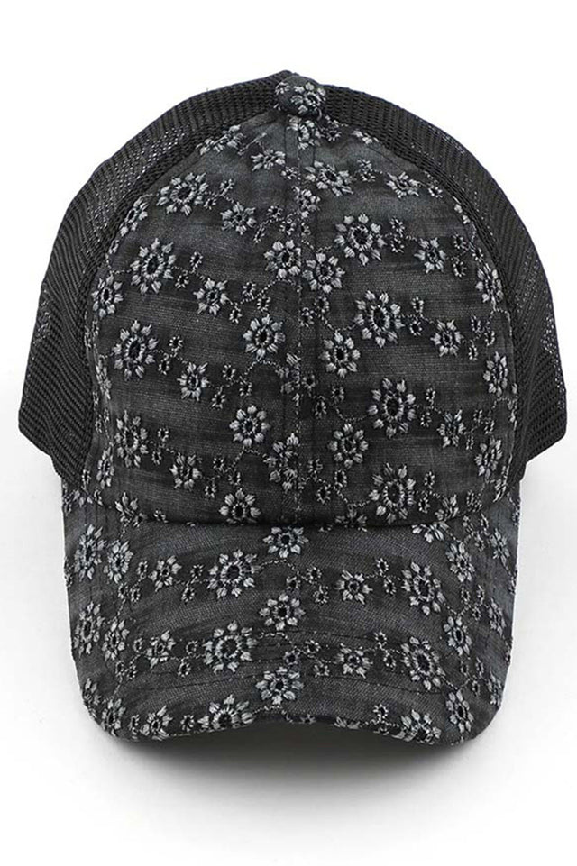 Black C.C FLOWER EMBROIDERY EYELET CRISS CROSS PONYCAP features delicate flower embroidery and eyelet detailing, with a criss cross design for a chic and stylish look. Made with quality materials, this cap offers both fashion and functionality. Perfect for any casual or outdoor activity, it will keep you cool and covered.
