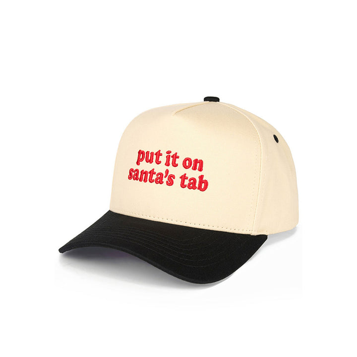 Bring holiday cheer wherever you go with the C.C “Put It On Santa’s Tab” Christmas Trucker Hat, crafted from 100% cotton for a soft, breathable feel. Featuring festive embroidered lettering and an adjustable snapback design, it’s the perfect playful accessory for celebrating the season in comfort and style.