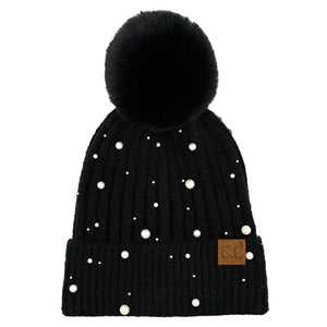 Black C.C Pearl Embellishments Pom Pom Beanie Hat, this stylish beanie is made from high-quality material for a comfortable and snug fit. Featuring pearl embellishments and a pom pom detail, this hat is sure to keep you looking stylish and chic in chilly weather. Perfect winter gift for friends and family.