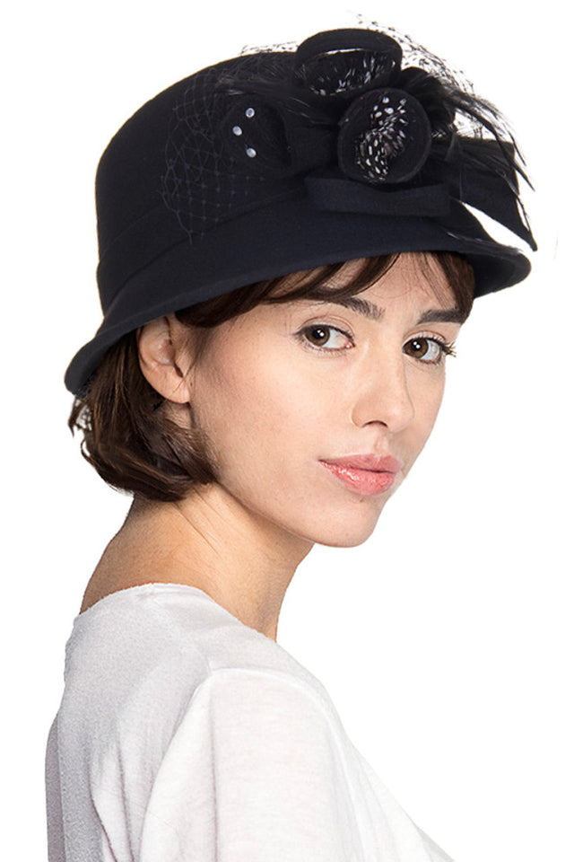 Black C.C. Wool Felt Hat combines exceptional craftsmanship with superior materials. Constructed from high-quality wool felt, it offers excellent shape retention and durability while providing effective protection from the elements. The classic silhouette ensures versatility across various outfits and occasions, making it an essential addition to any sophisticated wardrobe.