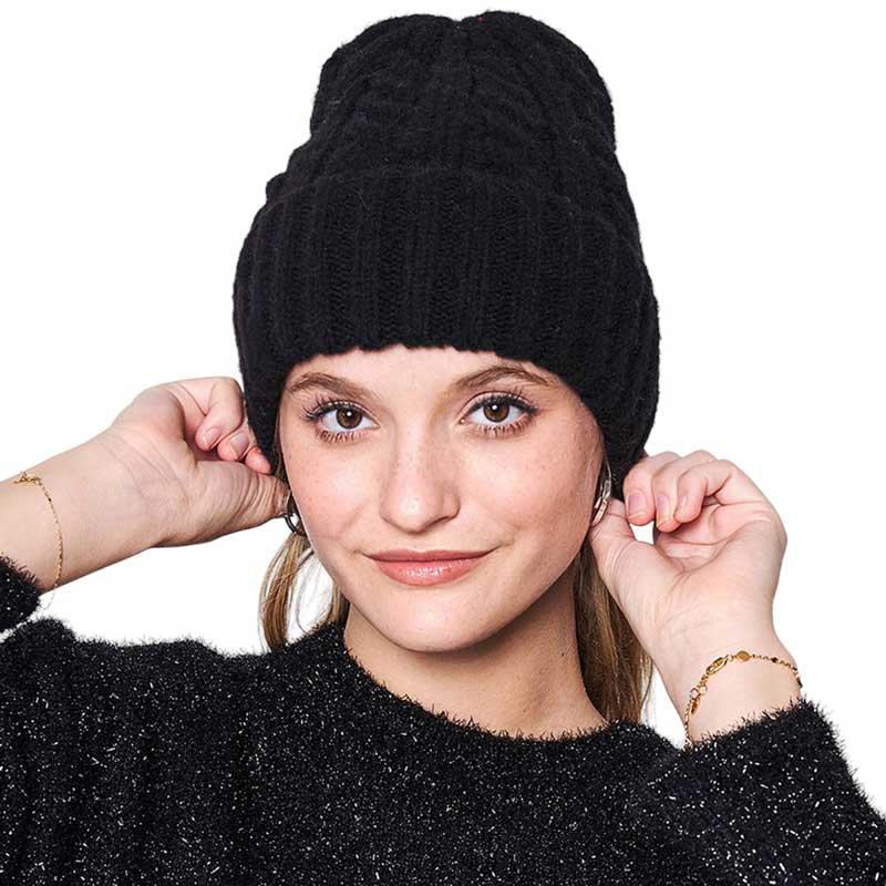 Black Solid Cable Knit Beanie Hat, Stay warm in style. Crafted with a soft, 100% acrylic fabric, this hat is perfect for cold weather days. The knit design ensures maximum comfort and breathability, while providing great protection from the cold. Enjoy this stylish and functional winter accessory. Ideal winter gift idea.