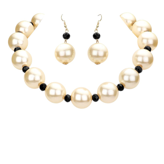 Black Cream Chunky Pearl Necklace is a timeless accessory for any occasion. Made from high-quality pearls, it exudes elegance and sophistication. Its chunky design adds a touch of modernity to a classic piece. Make a statement with this necklace that is sure to turn heads and elevate any outfit.