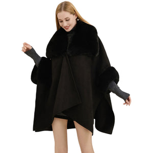 Black Faux Fur Trimmed Solid Ruana Poncho. Crafted with a faux fur-trimmed and a smooth fabric, this poncho gives you the perfect cold-weather accessory. Layer over your favorite outfits and stay warm and stylish. Give the perfect winter gift to your family members, friends, loved ones, or yourself with this stylish poncho.