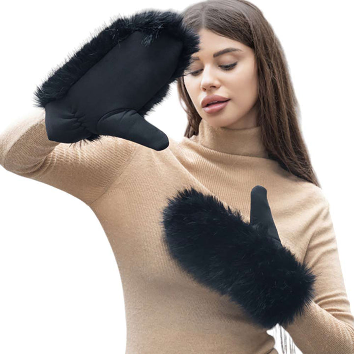 Black-Faux Fuzzy Fur Mitten Gloves offer warmth and style in one. Made with soft, faux fur material, they are perfect for keeping your hands cozy during the colder months. With their unique mitten design, they provide added protection and functionality. Stay fashion-forward and comfortable with these must-have gloves. 