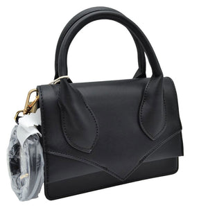 Black Faux Leather Top Handle Le Chiquito Tote Bag, is stylish, durable, and practical. The bag is made of faux leather with a sturdy top handle and an adjustable shoulder strap. The roomy design offers plenty of space. Experience effortless style and convenience with this chic, multi-functional tote.
