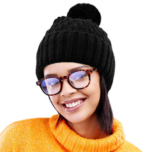 Black Fleece Lining Solid Knit Faux Fur Pom Pom Beanie Hat, Stay warm and stylish this season with this hat. This classic hat is perfect for gifting, crafted with a solid knit and lined with soft fleece to provide superior warmth and comfort on cold days. Perfect winter accessory for outdoor activities.