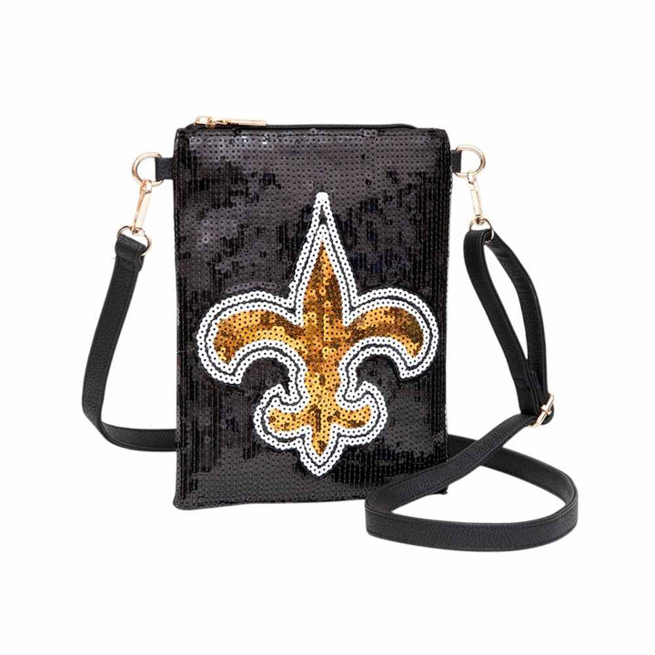 Black-Fleur de Lis Accented Sequin Crossbody Bag is a stylish and versatile accessory, perfect for any occasion. With its intricate Fleur de Lis detailing and shimmering sequins, it adds a touch of elegance to any outfit. The crossbody design allows for hands-free convenience, and the compact size makes it easy to carry anywhere. A must-have for fashion-forward individuals.