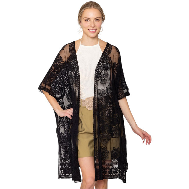 Black Flower Lace Kimono Poncho is a versatile and fashionable addition to any wardrobe. The delicate lace detailing adds a touch of elegance, while the kimono style allows for comfortable and easy wear. Perfect for dressing up any outfit, this poncho is a must-have for any fashion-forward individual. 