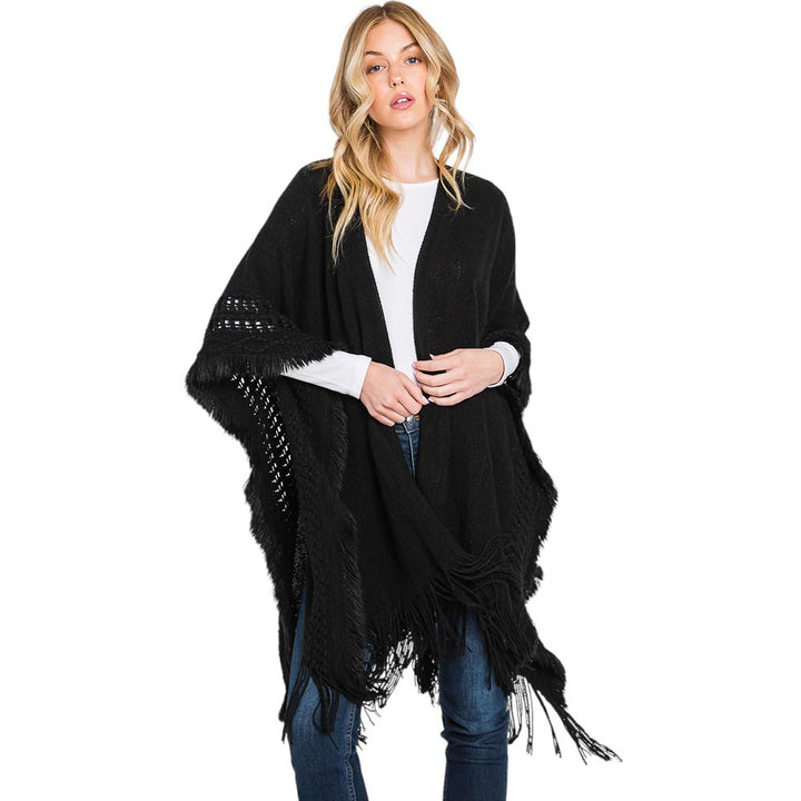 Black Fringe Cut Out Knit Ruana Poncho, with the latest trend in ladies' outfit cover-up! the high-quality knit poncho is soft, comfortable, and warm but lightweight. It's perfect for your daily, casual, party, evening, vacation, and other special events outfits. A fantastic gift for your friends or family.