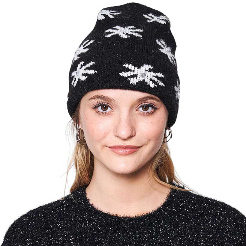 Black Gem Flower Beanie Hat, Stay warm and fashionable with this. This knitted beanie features an intricate flower design with gems embedded in each petal, adding a glamorous sparkle to any outfit. The classic ribbed-knit construction ensures a snug fit for the perfect cold-weather accessory.