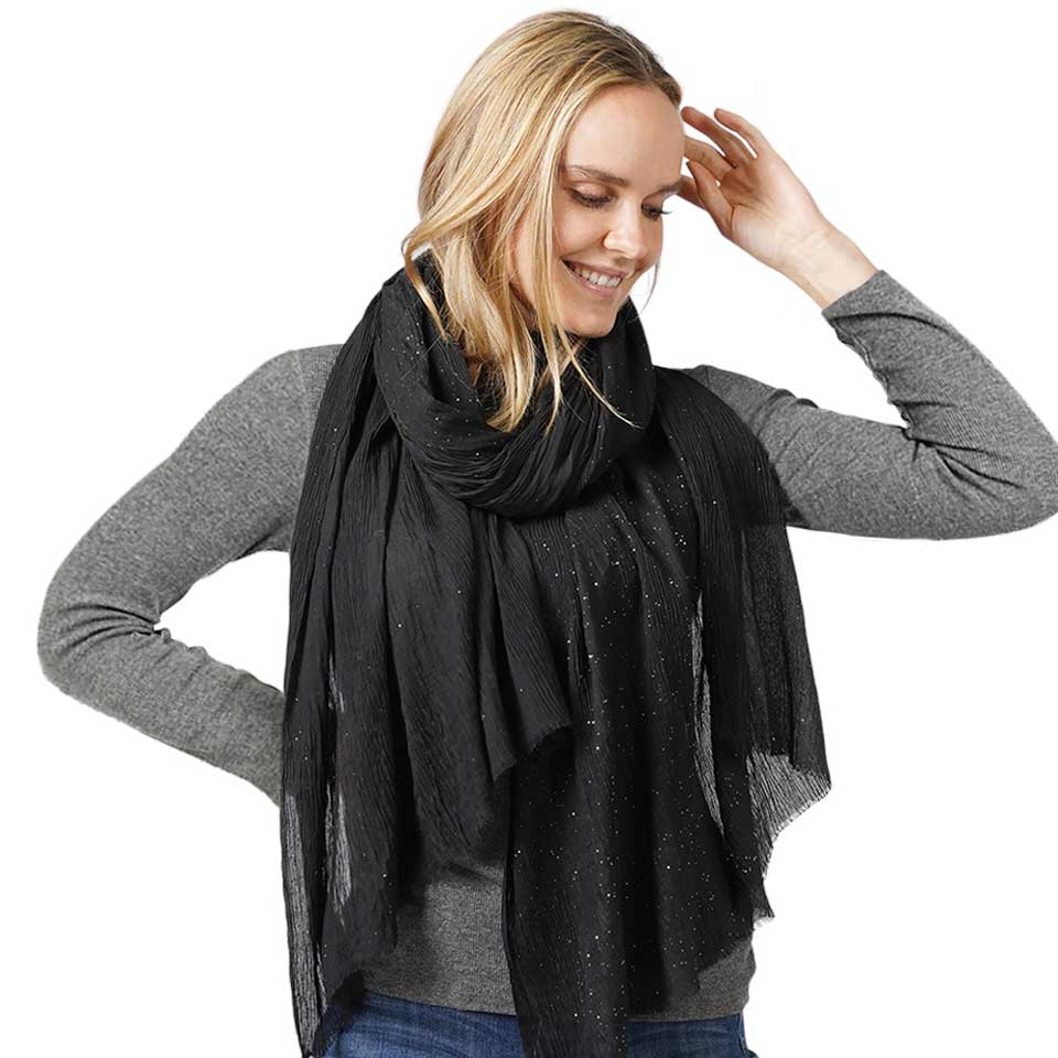 Black Glittered Crinkle Scarf, this timeless glittered crinkle scarf is a soft, lightweight, and breathable fabric, close to the skin, and comfortable to wear. Sophisticated, flattering, and cozy. Look perfectly breezy and laid-back as you head to the beach. Perfect gift for birthdays, holidays, or fun nights out.