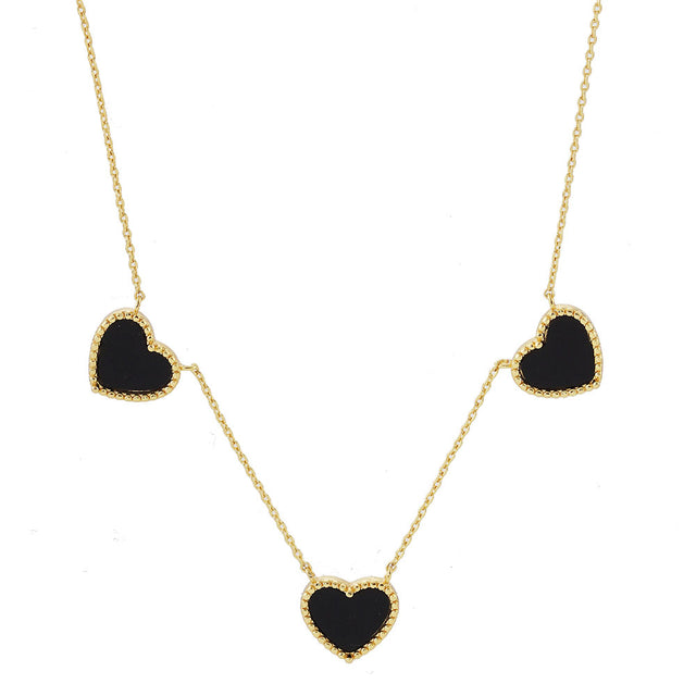 Black Gold Dipped Triple Heart Pendant Necklace adds a touch of romance to any outfit. Crafted with quality and precision, each heart is dipped in genuine gold for a luxurious finish. This necklace is a stunning addition to any jewelry collection, perfect for special occasions or everyday wear.