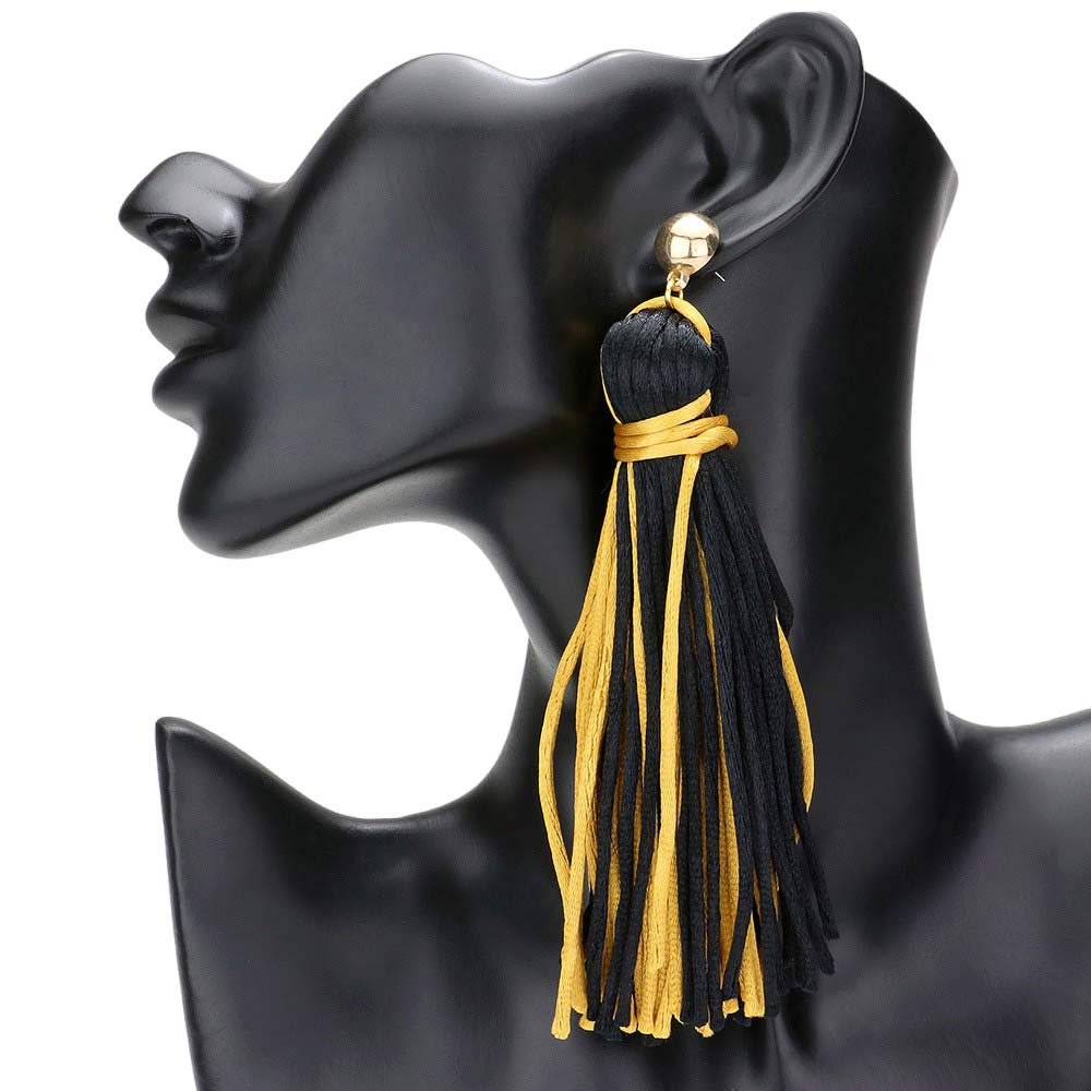 Black Gold Yarn Tassel Dangle Earrings, Experience bohemian chic with these. Crafted with soft yarn and adorned with delicate metal accents, these earrings add a touch of playful elegance to any outfit. Embrace your unique style and elevate your look with these stunning statement earrings.