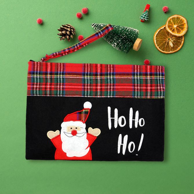 Holiday-themed zipper pouch with a cheerful Santa and “Ho Ho Ho” embroidery. Features a festive plaid trim and handy wrist strap. Ideal for gifting, organizing holiday essentials, or seasonal travel.