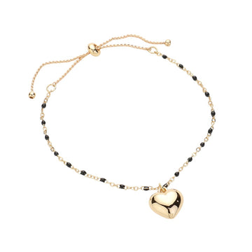 Black Metal Heart Charm Beads Station Pull Tie Cinch Bracelet is a stylish and versatile accessory to add to your jewelry collection. The metal heart charm beads add a touch of elegance, while the pull tie cinch design allows for an adjustable and comfortable fit. Perfect for any occasion, this bracelet is a must-have for any fashion-forward individual