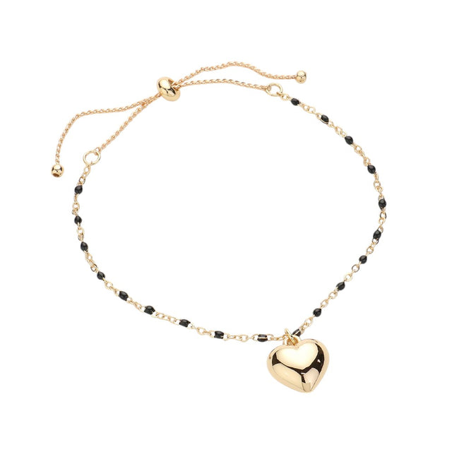 Black Metal Heart Charm Beads Station Pull Tie Cinch Bracelet is a stylish and versatile accessory to add to your jewelry collection. The metal heart charm beads add a touch of elegance, while the pull tie cinch design allows for an adjustable and comfortable fit. Perfect for any occasion, this bracelet is a must-have for any fashion-forward individual