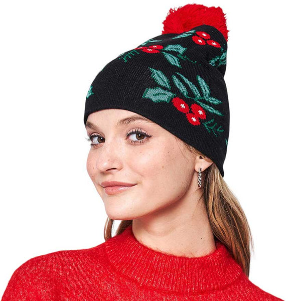 Black Mistletoe Pom Pom Beanie Hat. You'll love the classic look of the hat. Its cozy design combines style and comfort for a winter-ready look. Made with high-quality materials, this beanie is soft. Enjoy the festive look of the mistletoe pom pom, perfect for the winter season. Ideal gift item for any winter occasion.