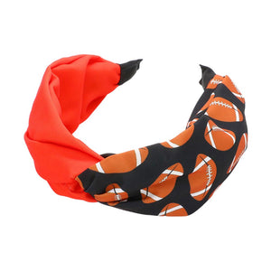 Black Orange Game Day Football Patterned Twisted Headband, Stay stylish and comfy with this Headband. This headband is designed with a soft fabric material for comfort and is patterned with an eye-catching football design for a game-day-ready look. Attend your team's play with this  Football Patterned Twisted Headband. 