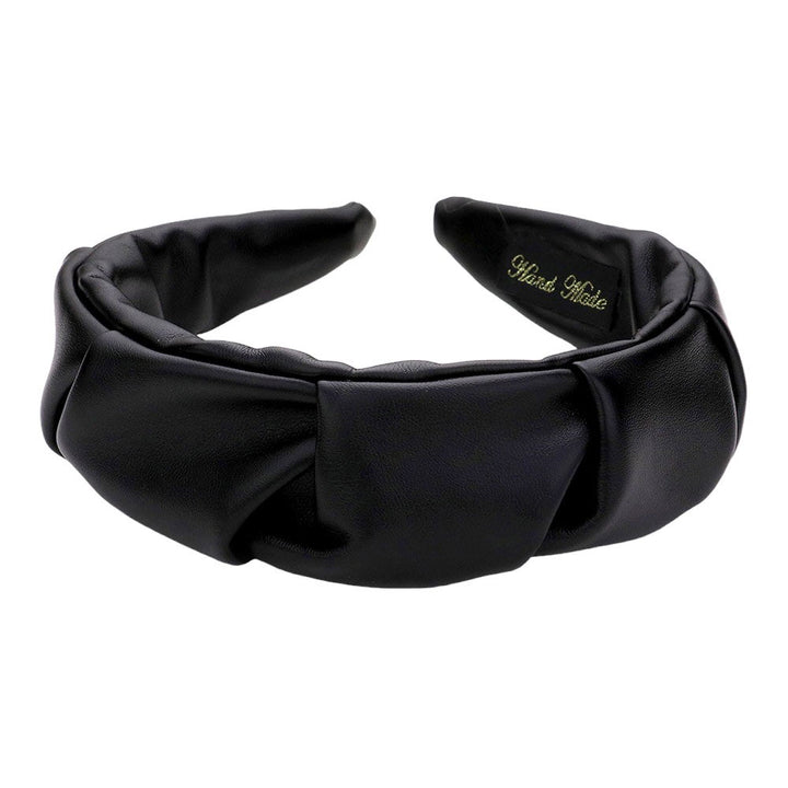 Black Pleated Solid Faux Leather Headband, This stylish accessory adds an elegant touch to any outfit. Made with high-quality materials, it is both comfortable and durable. The pleated design offers a unique, sophisticated look, while the faux leather adds a touch of luxury. Perfect for any formal or casual occasion wear.