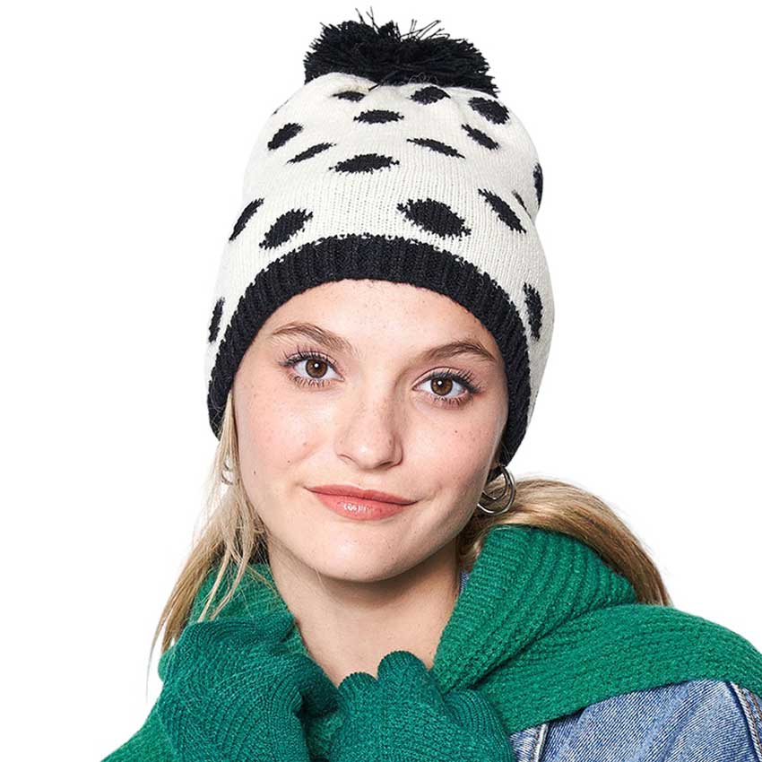 Black Polka Dot Pom Pom Beanie Hat, Protect yourself from the cold with this fashionable and cozy beanie. This stylish beanie features a soft fleece lining and an all-over polka dot design for a playful look. Perfect for winter outdoor activities or daily wear. Fashionable Christmas gift idea for family members and friends.