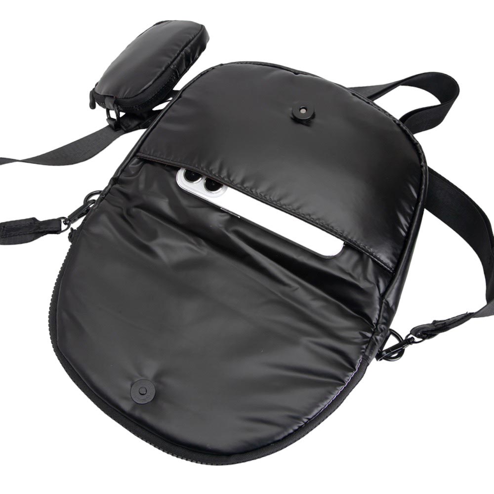 Black Puffer Half Moon Crossbody Bag, the lightweight, stylish design features a durable water-resistant nylon that is perfect for outdoor activities. The adjustable shoulder strap makes it easy to sling across your body for hands-free convenience. Carry your essentials in style and comfort with this fashionable bag.