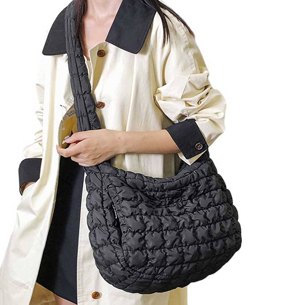 Black Quilted Puffer Shoulder Crossbody Bag Cloud Bag, offers a sleek and stylish way to carry your essentials. Made with a unique quilted puffer design, this bag provides both durability and lightweight comfort. The perfect accessory for any occasion, it offers the perfect blend of fashion and function.