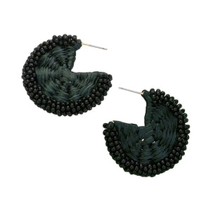 Black Raffia Wrapped Seed Beaded Round Earrings, Expertly crafted with a combination of raffia and seed beads, these round earrings add a touch of natural elegance to any outfit. The intricate beadwork and unique wrapping technique showcase expert artistry. Elevate your style with these earrings, perfect for any occasion.