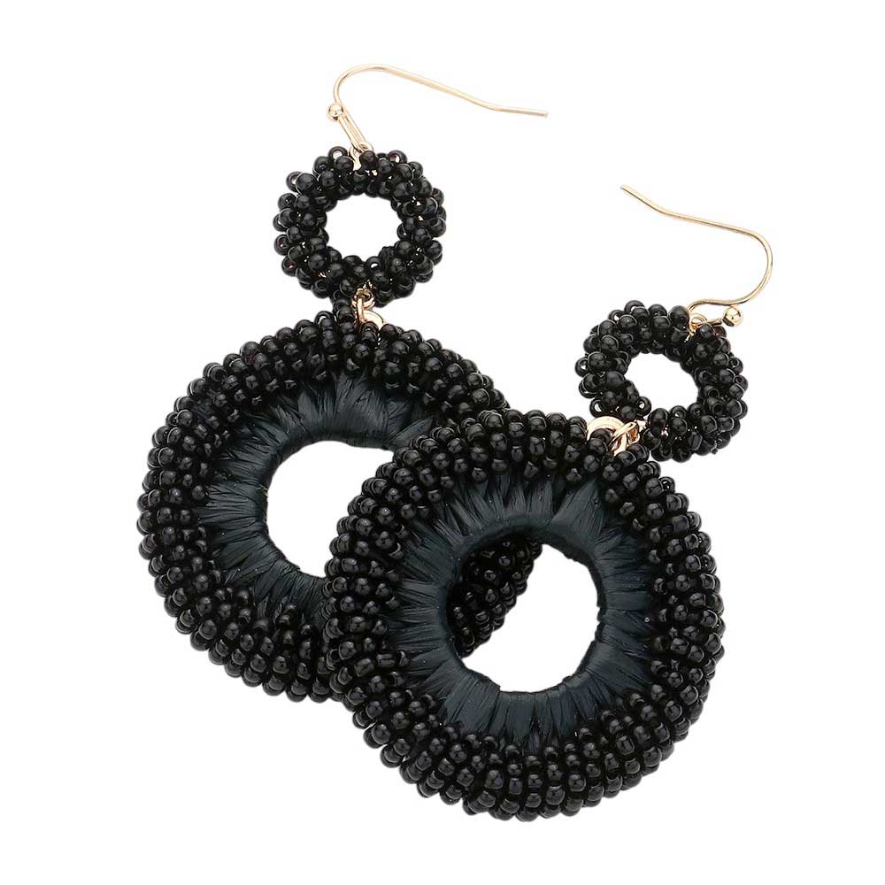 Black Seed Beaded Raffia Wrapped Open O Link Dangle Earrings, Discover the perfect blend of style and sustainability with these. Crafted with natural raffia and intricately beaded, these earrings add a touch of bohemian chic to any outfit. Plus, with an open O link design, they're lightweight and comfortable to wear all day.