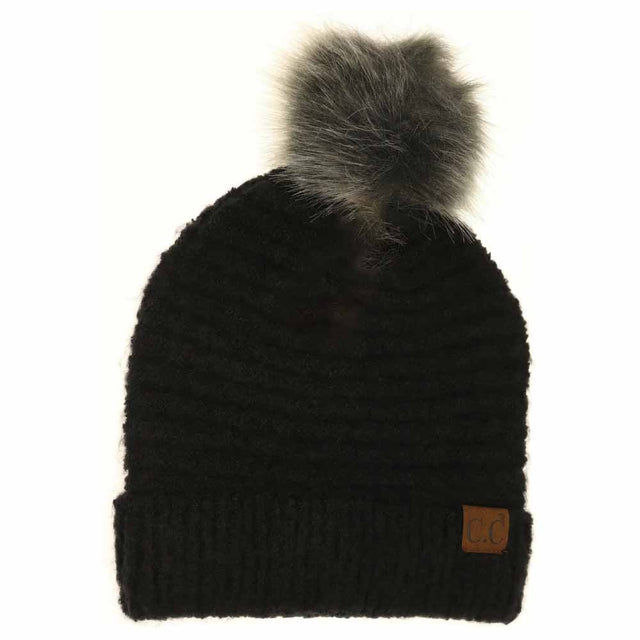 Black Solid Boucle Knit Pom CC Beanie combines texture and warmth through its soft boucle knit fabric. Designed for expert-level comfort, this beanie features a classic silhouette topped with a playful pom for a refined yet casual look. Ideal for cold weather, it offers durable insulation while maintaining breathability, making it a versatile accessory for everyday wear. 