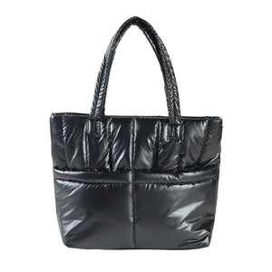 Black Solid Puffer Tote Shoulder Bag, is an impressive combination of fashion and practicality. Made of durable material, this shoulder bag offers superior protection from impacts with its padded construction, and also features a shoulder strap for added convenience. Give one of these bags as a gift to your favorite ones.