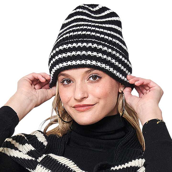 Black Striped Knit Beanie Hat. Stay warm and fashionable in any weather with this. Crafted from soft acrylic yarn, this beanie is designed to keep you warm and cozy. The textured striped knit pattern creates a unique and stylish look that's perfect for any occasion. Ideal gift item on cold days for your loved ones. 