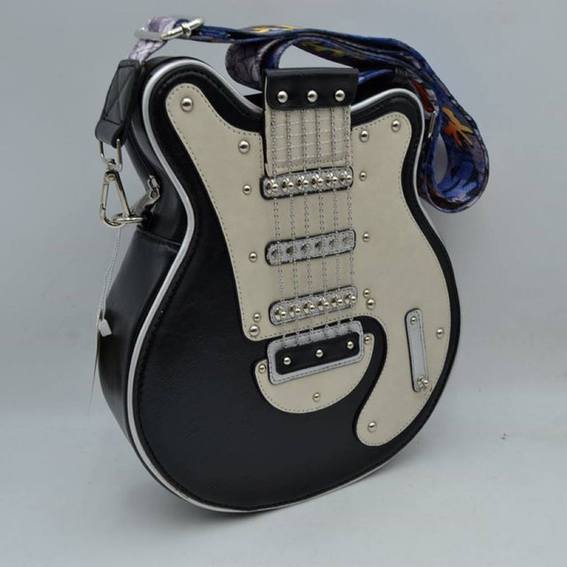 Black This unique novelty handbag features a structured silhouette designed to look like an electric guitar, making it an exceptional statement piece for music lovers. The prominent front panel showcases a color-blocked black and off-white design detailed with polished metallic studs, faux pickups, and delicate hanging chain links that mimic classic guitar strings. Equipped with a secure top zipper closure to keep your essentials safe