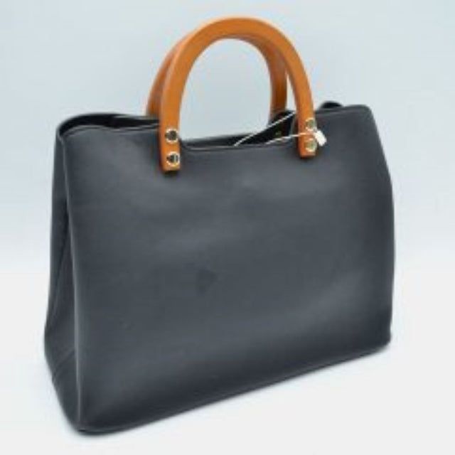 Black This classic tote bag features a sleek, structured silhouette with a smooth finish, making it a stylish choice for everyday work or travel. Designed with a wide open-top layout, it provides easy access to a spacious main compartment to store and organize your daily essentials. Dual rounded contrast-colored wooden top handles attached with metallic hardware offer a comfortable grip and add an elevated, modern touch to the timeless design.