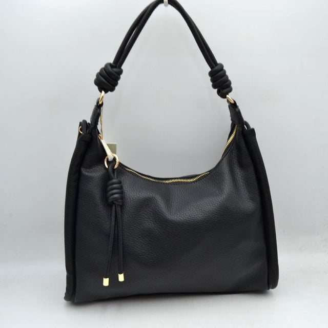 Black Bring a perfect blend of relaxed style and modern sophistication to your wardrobe with this slouchy hobo shoulder bag. Crafted with a premium pebble-grain textured exterior, this everyday handbag features unique coiled knot accents on the shoulder strap and a matching decorative hanging tassel for a contemporary touch. Designed to comfortably rest on your shoulder or slip onto your forearm, it opens up to a roomy main compartment ideal for organizing your phone, wallet, cosmetics