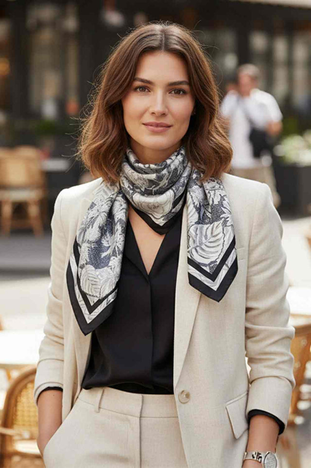 Black Elevate your accessory game with this versatile Abstract Floral Print Bandana Scarf. Featuring a striking abstract floral design with bold solid thick lines, this lightweight scarf is crafted from 100% polyester for a silky-smooth feel against your skin. Perfect for any season, wear it as a headwrap, neck scarf, or tie it to your bag for an instant style boost. The generous 35" x 35" square cut gives you endless styling possibilities. Whether you're dressing up or keeping it casual, this all-season es