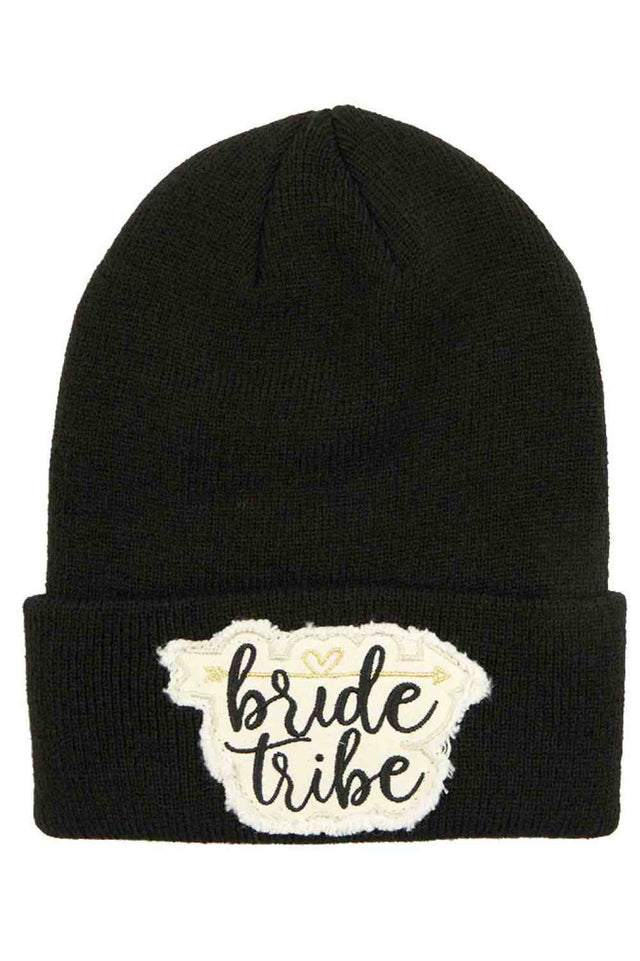 Black The C.C Knitted Cuffed Beanie with Bride Tribe Patch is a cozy, soft knit hat featuring a classic folded cuff and a fun “Bride Tribe” patch detail. Perfect for bachelorette parties, bridal showers, or wedding festivities, it keeps your crew warm while adding a stylish, celebratory touch.