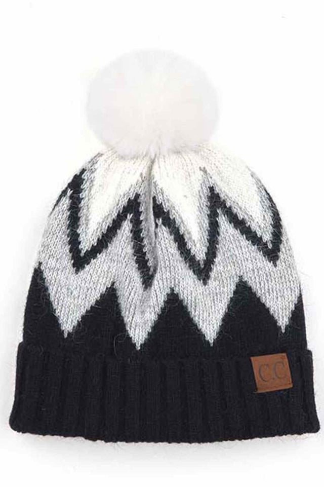 Black Stay warm and stylish with this chevron knit beanie crafted from a premium blend of 70% acrylic and 30% angora. The ribbed construction provides a snug fit, while the fluffy pom pom adds a playful touch. Soft, breathable, and designed to complement any winter look, this versatile beanie is your go-to accessory for cold weather comfort.