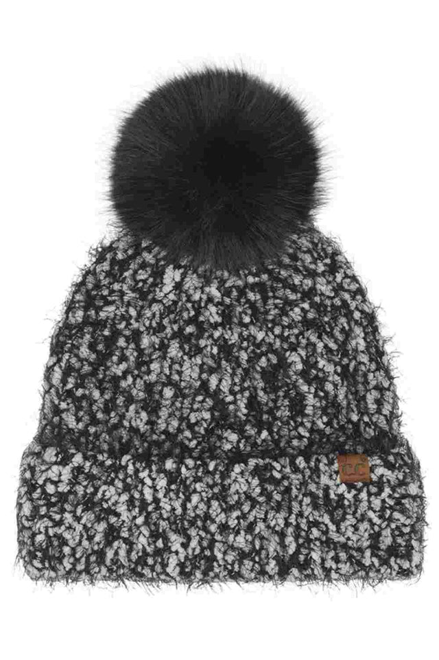 Black C.C Faux Fur Pom Boucle Cuff Beanie Winter Hat features cozy boucle knit paired with a plush faux-fur pom for a stylish, winter-ready finish. Designed with a soft cuff and stretch fit, it delivers warm comfort while adding effortless charm to your cold-weather looks.