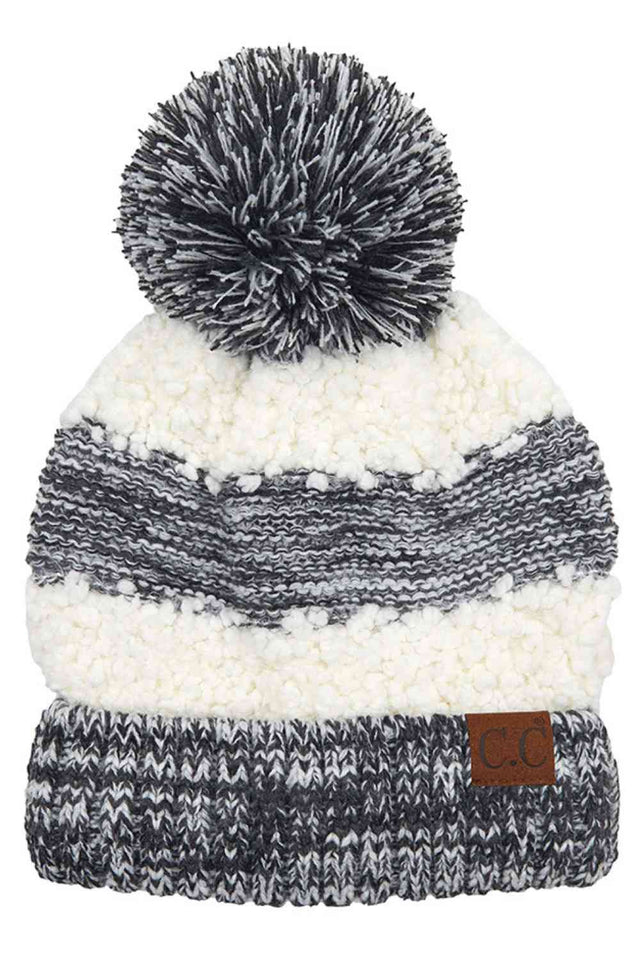 Black Cozy up in style with this C.C Popcorn Yarn Heather Beanie, featuring a playful pom-pom on top. The textured popcorn yarn creates a unique, dimensional look while the soft heather tone complements any winter outfit.